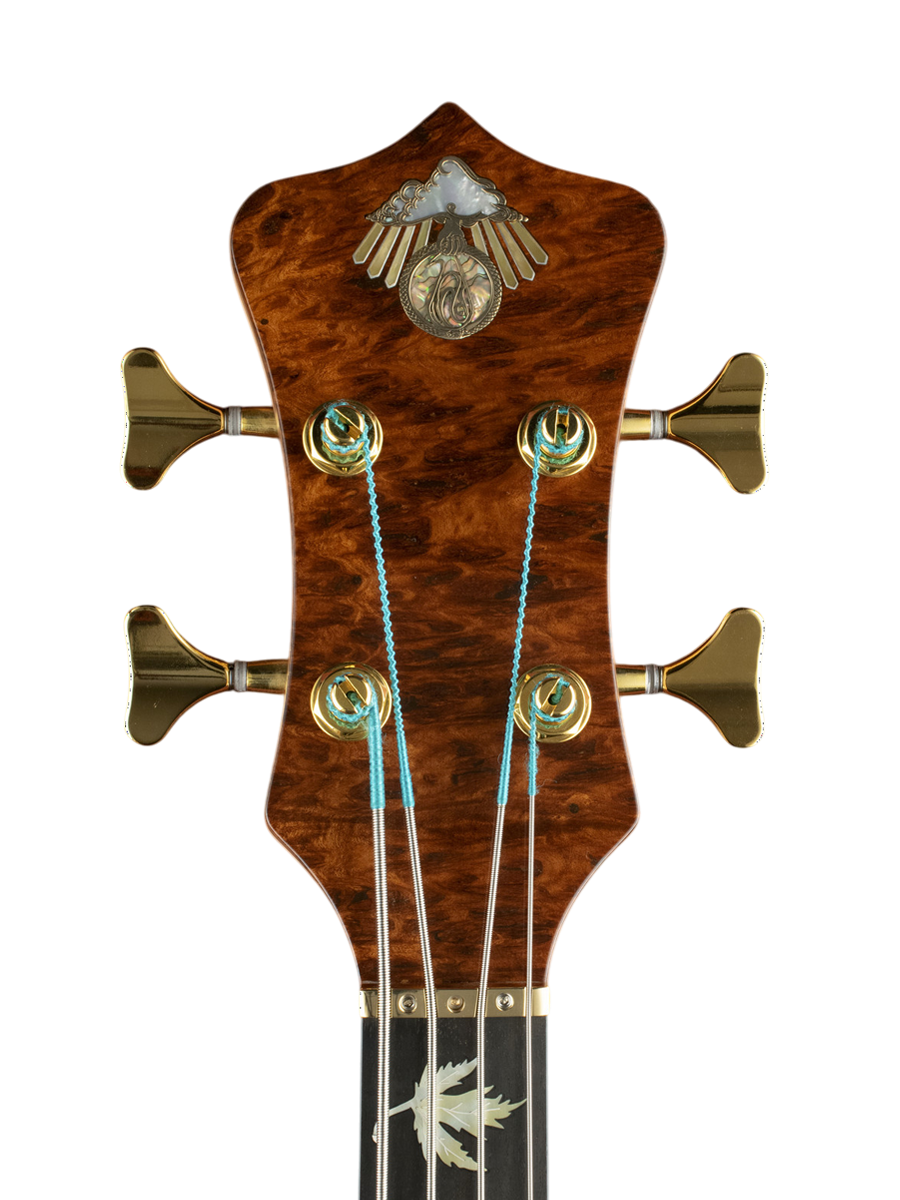 Bronze inlaid logo with mother of pearl and red abalone plus silver lined gold mother of pearl rays