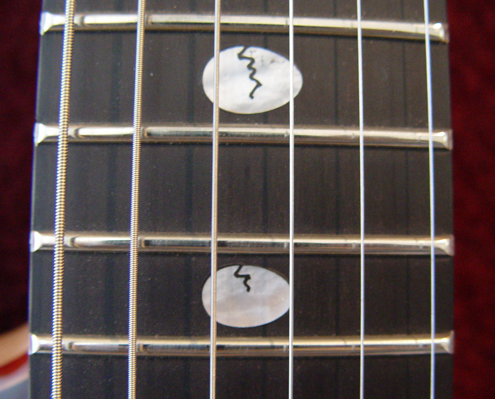 Fingerboard inlay
